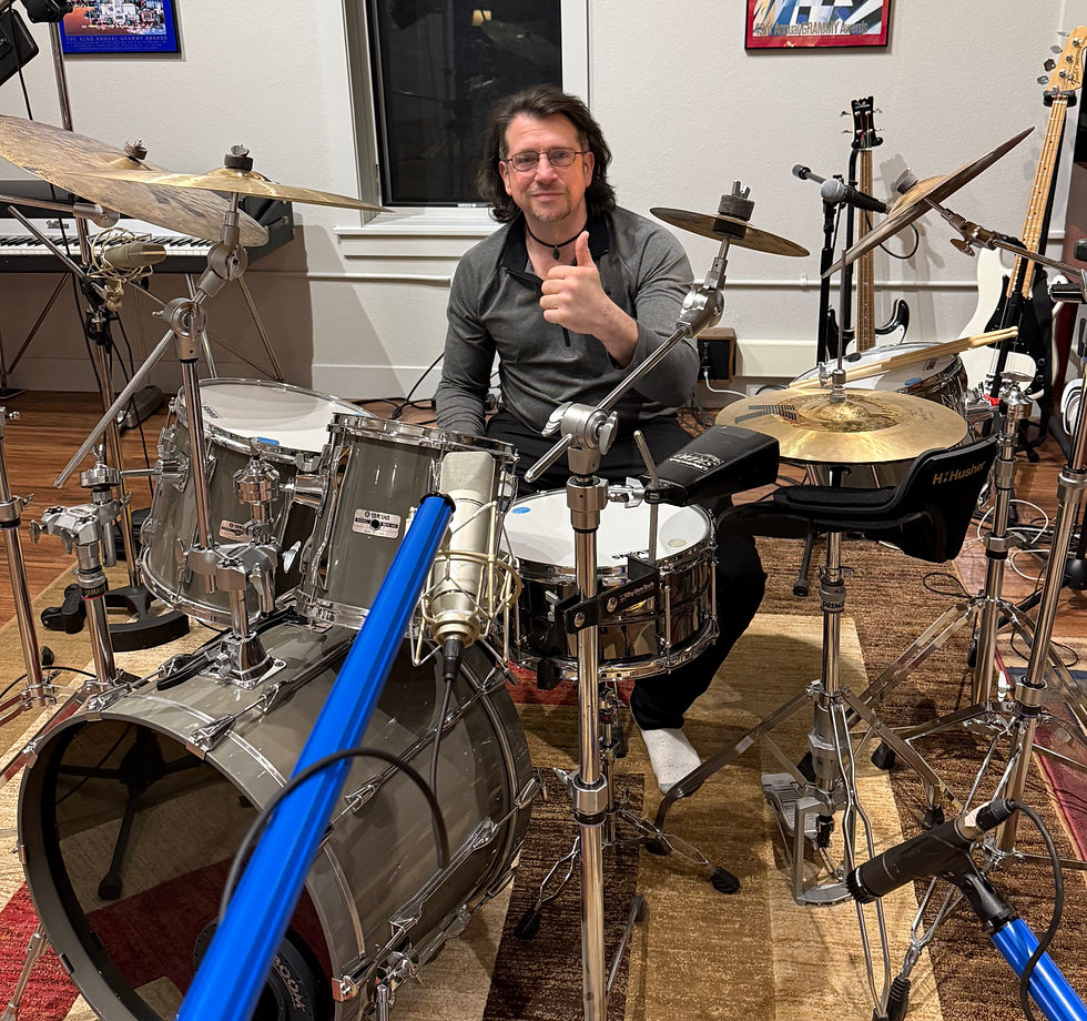 Brett Roberts giving a thumbs-up sign during a recording session at Timber Canyon Studio in Wyoming