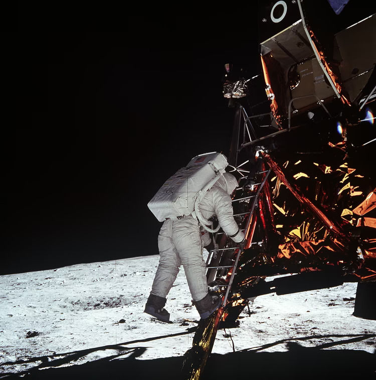Astronaut Buzz Aldrin steps off the ladder from the lunar module and onto the moon. (NASA)