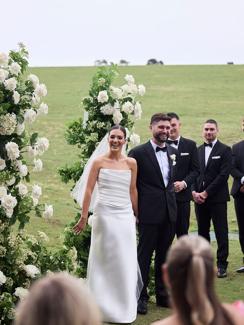 A couple laughing during their wedding ceremony in the yarra valley by shaun koster