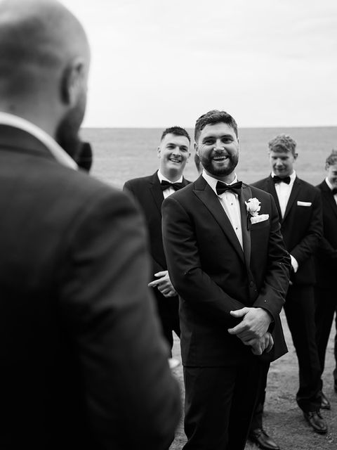 Groom laughing at a joke Shaun Koster is making.