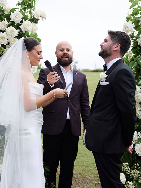 Couple laughing during their vows