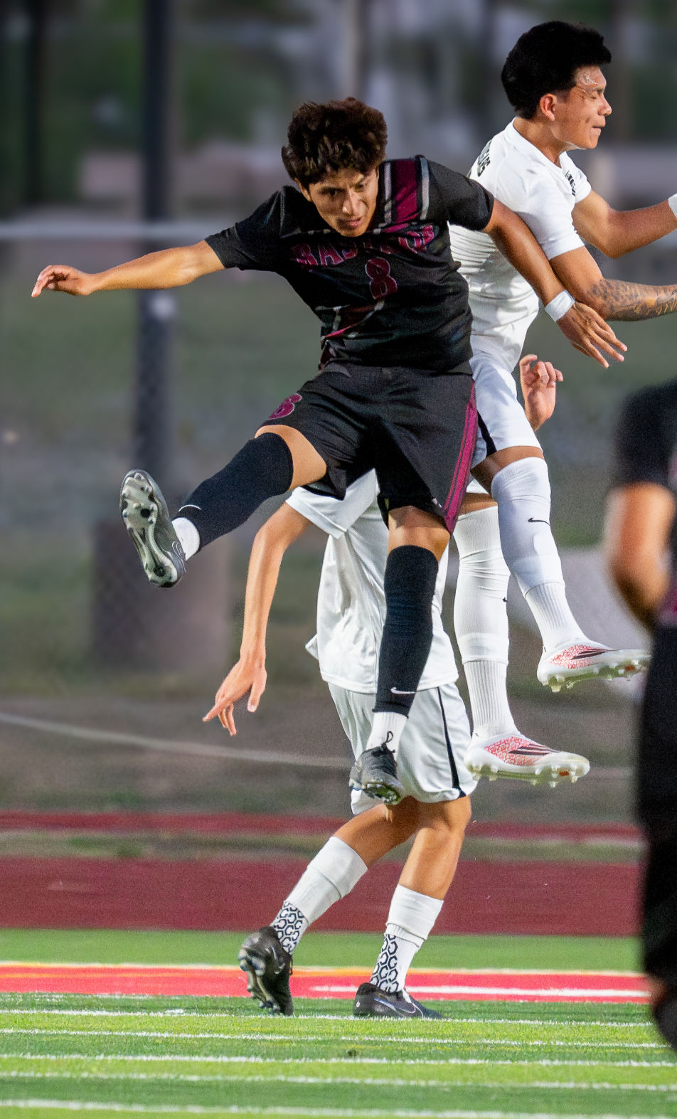 Bastrop's Isaac Velazquez (left) battles in the air