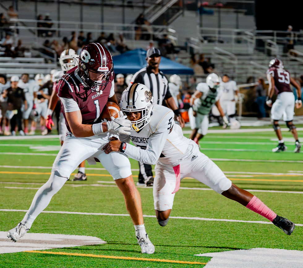 Bastrop wide receiver Dallas Crescenzo (1) scores despite close coverage by a Crockett defender