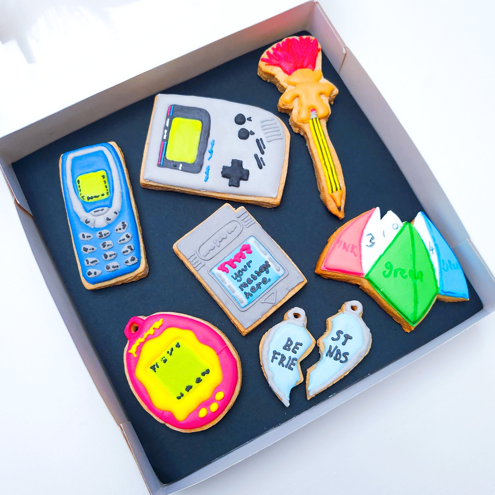 Thumbnail: 90s inspired iced biscuits arranged in premium packaging