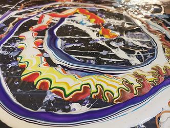 A colourful abstract picture of spun paint