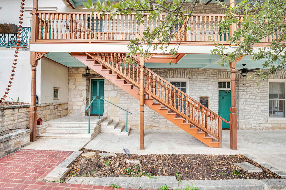 Austin general contractor historic commercial remodeling and tenant improvement with restored balcony and staircase tenant finish out.