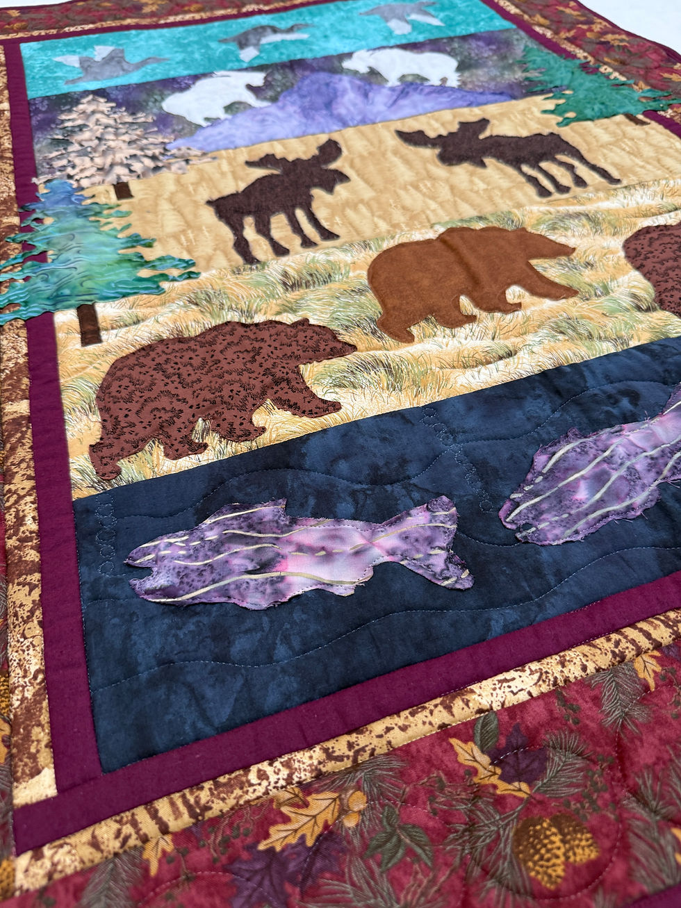 Thumbnail: Wildlife wall hanging featuring four scenic panels with waterfowl, mountain goats, moose, bears, and fish