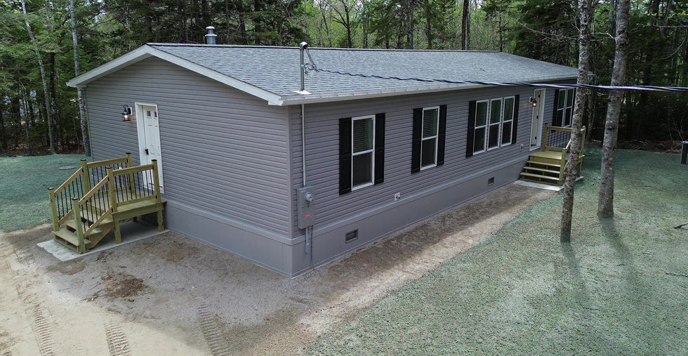 193 Sandy Acres Outside with hydroseeded lawn