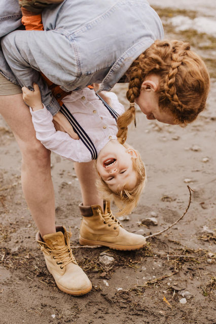 Mum and son laughing during family photos