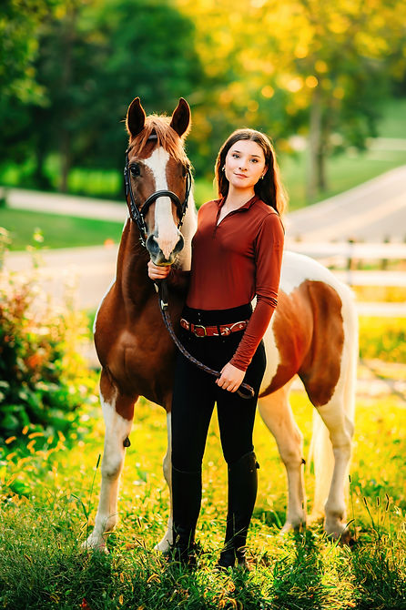 A Pittsburgh area senior poses with her horse during her senior photo session near Morgantown, WV