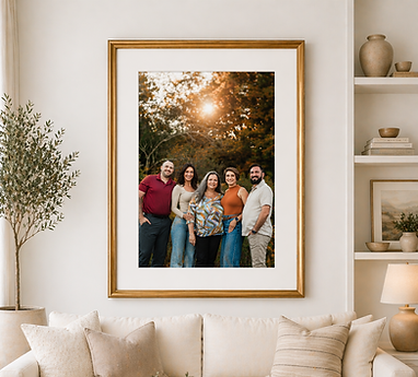 A family portrait hangs above a couch.