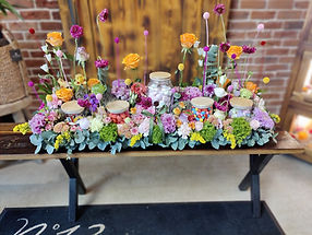 Composition de fleurs avec bonbons