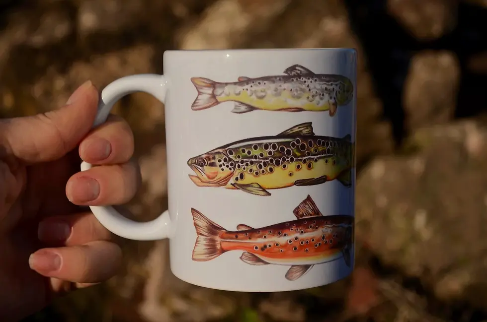 Trout mug held in hand
