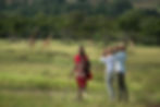 Safari visitors using their binoculars while encountering a local resident