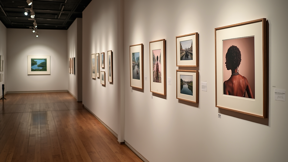 High angle view of a gallery wall with diverse framed art and photos
