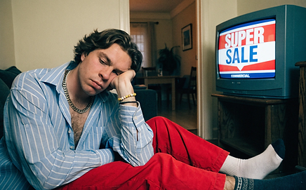 man-bored-with-tv-commercials.png