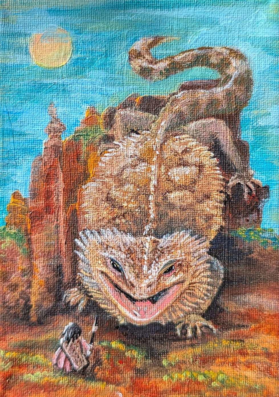 A giant bearded dragon flicks it's tail against a light blue sky as it crawls down a bright orange, flat-topped mesa to meet an adventurer. She stands ready in a pink skirt, with a geometrically-patterned shawl and a stone pointed spear. The orange sands flare along the bottom of the canvas, but there are still flecks of green and yellow foliage on the ground and the tops of the mesa.