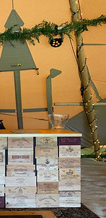 A stylish mobile bar with a bartender serving drinks, featuring a rustic wooden design and elegant decor, creating a charming