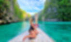 Beautiful woman sitting on a private longtail boat in Koh Phi Phi in Pileh Lagoon