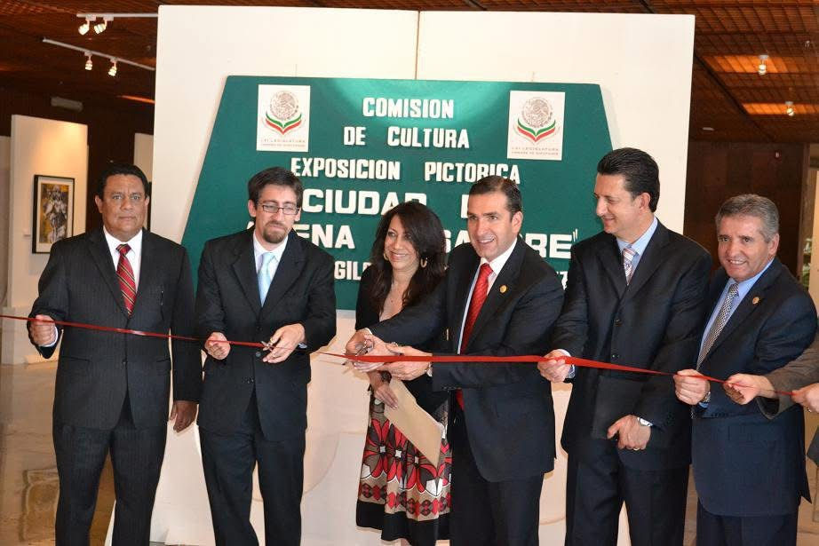 Mexican artist Gildalorena Martínez and officials cutting the ribbon at the opening of the art exhibit City of Sand and Blood in Mexico's Federal Chamber of Deputies in Mexico City, 2011. 