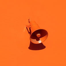 orange megaphone on orange wall_edited.j
