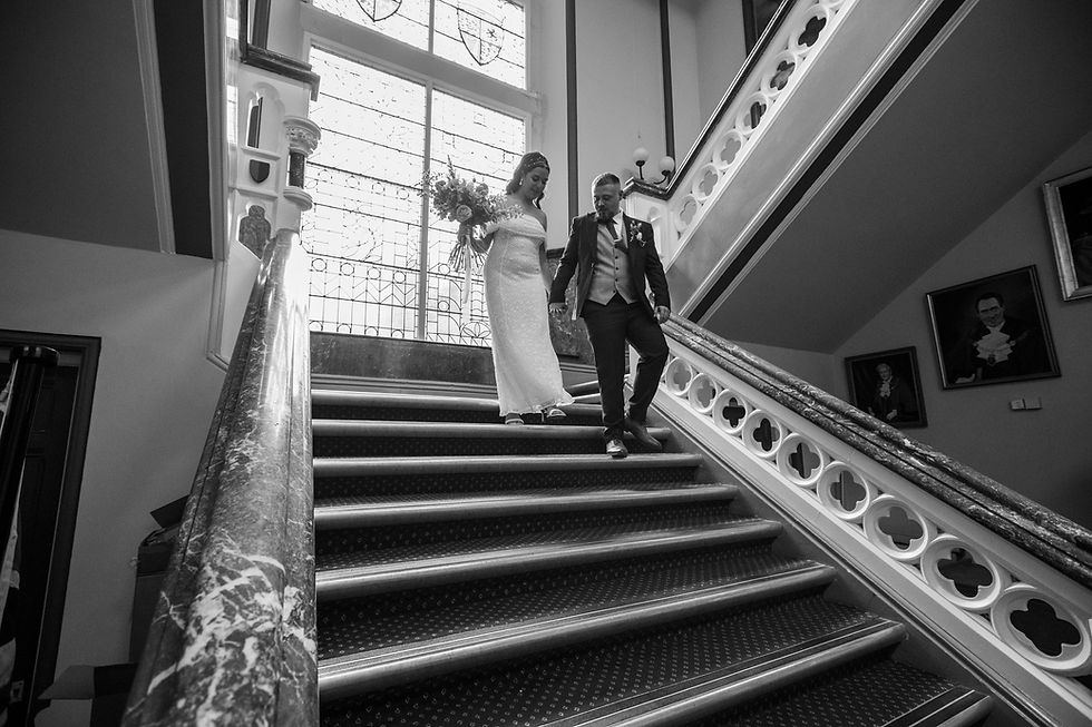 Bride and groom posing for wedding portraits