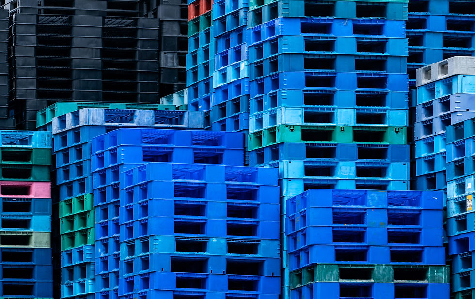 Stacks of plastic pallets