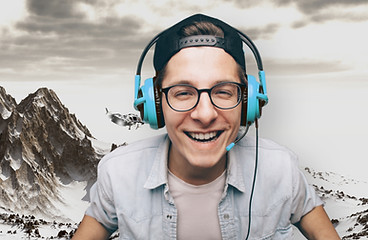 Young Man with Headphones Playing Video
