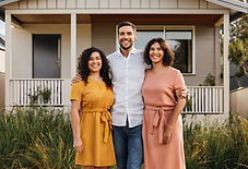 Family standing in front of their new home, showcasing the benefits of the HomeStart Finan