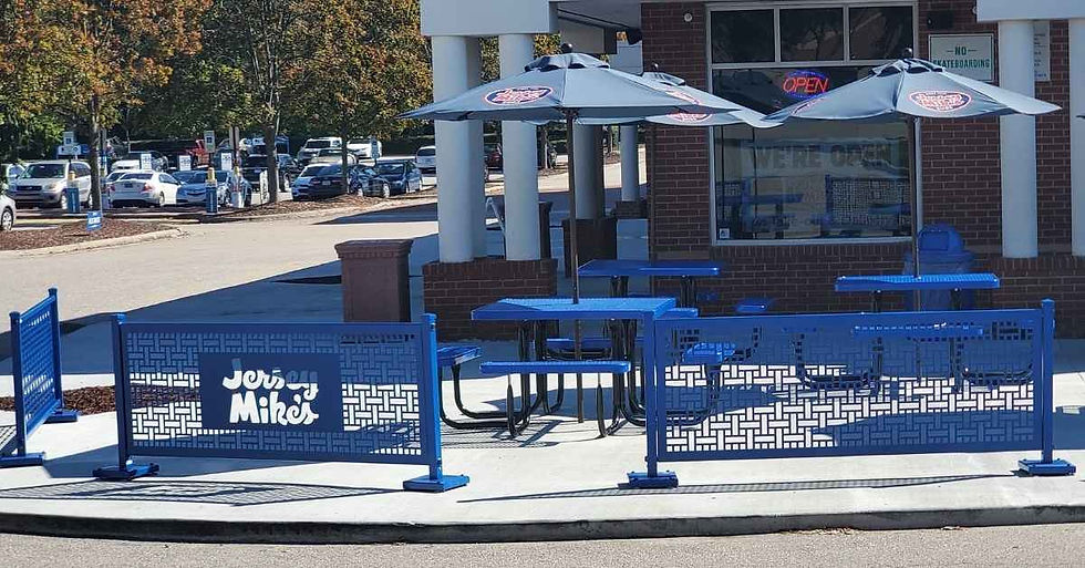 Blue branded fencing at Jersey Mike's