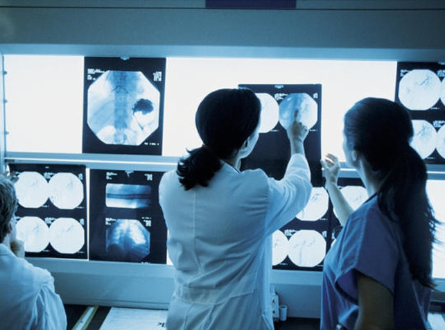 Radiologist looking at x-rays