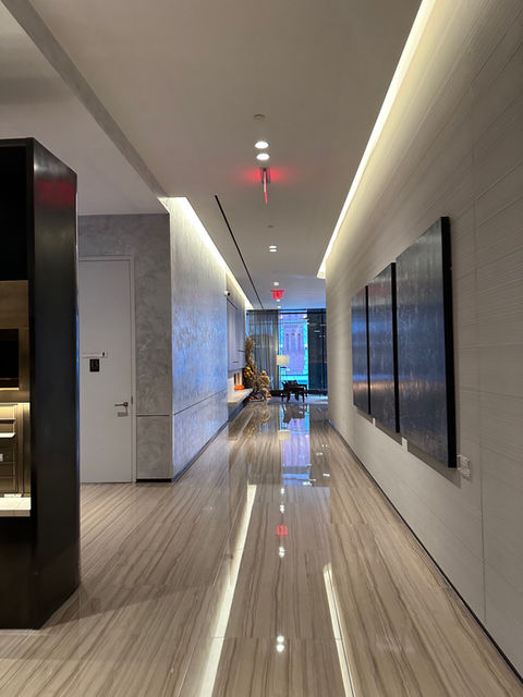 a hallway with a paintings