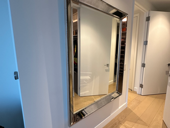 Professional mirror hanging service in Manhattan apartment