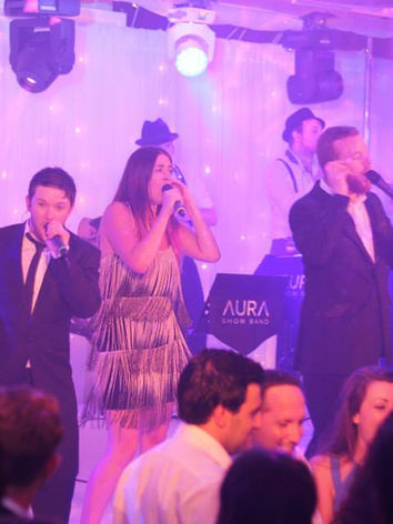 AURA Showband performing live with male and female singers at a high-end wedding reception at The Midland Hotel, Manchester