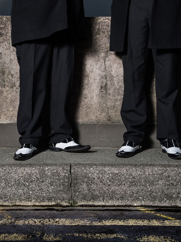Comedy barbershop quartet Afternoon Delight showing off vintage shoes and character poses.