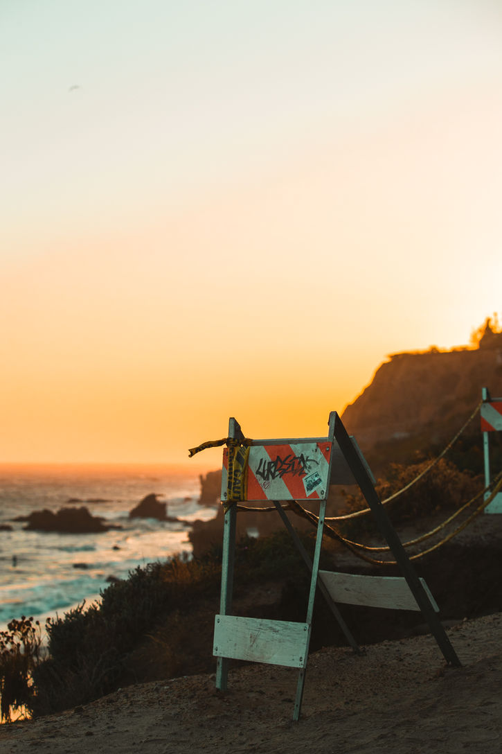 Photography by Spencer McCray — Golden coastal sunset over ocean with barrier | Los Angeles photographer
