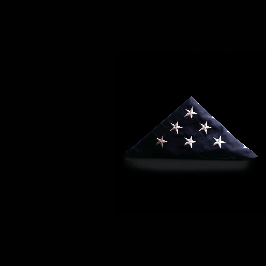 Folded American flag honoring the defenders of freedom