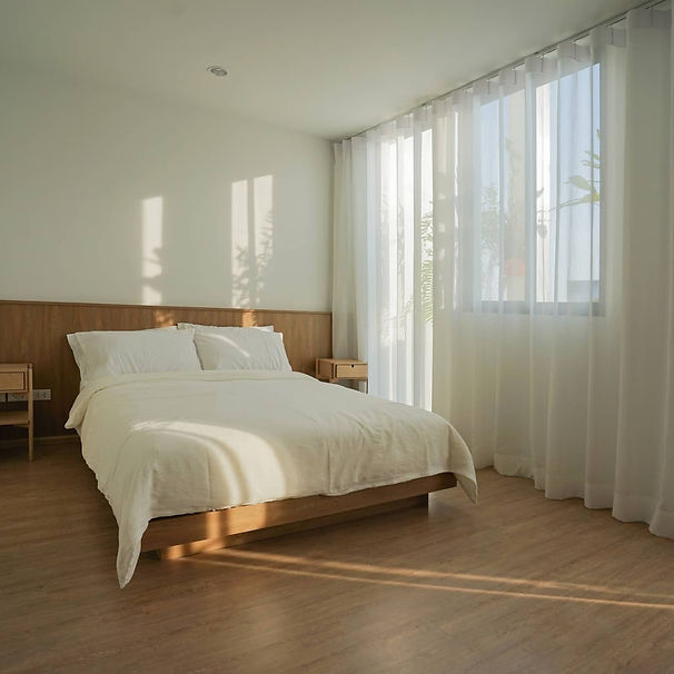 laminate flooring installed in bedroom. Cozy vibe and japandi style. Natural wood colour for flooring.
