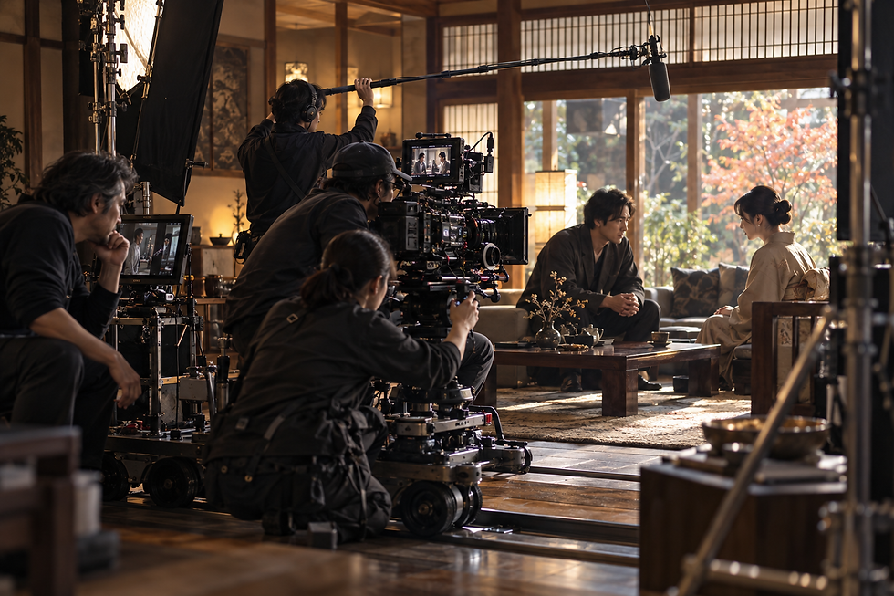A film crew operating a cinema camera and sound equipment on a Japanese set