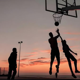 basketball game at sunset