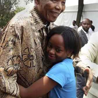 Nelson Mandela with a child