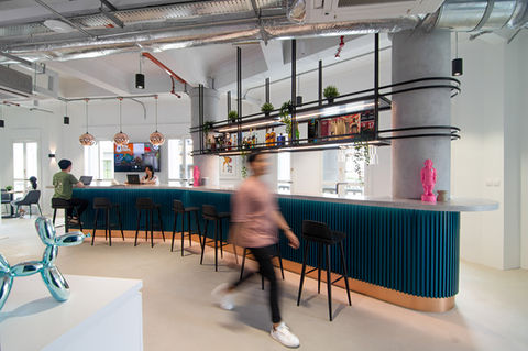 spacious office featuring a stylish bar area