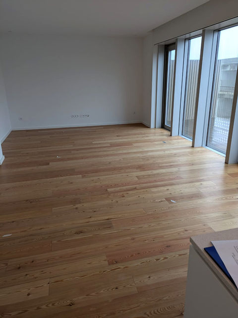 Light oak wood flooring in modern apartment