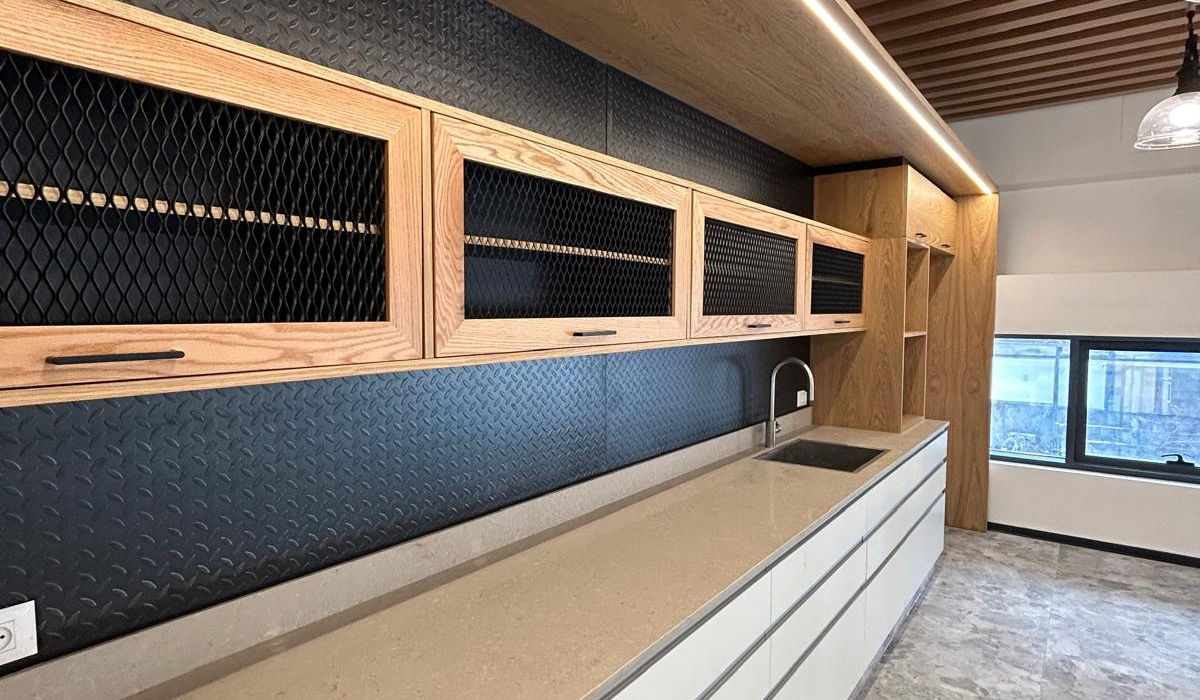 Modern office kitchen with wooden cabinets and countertop