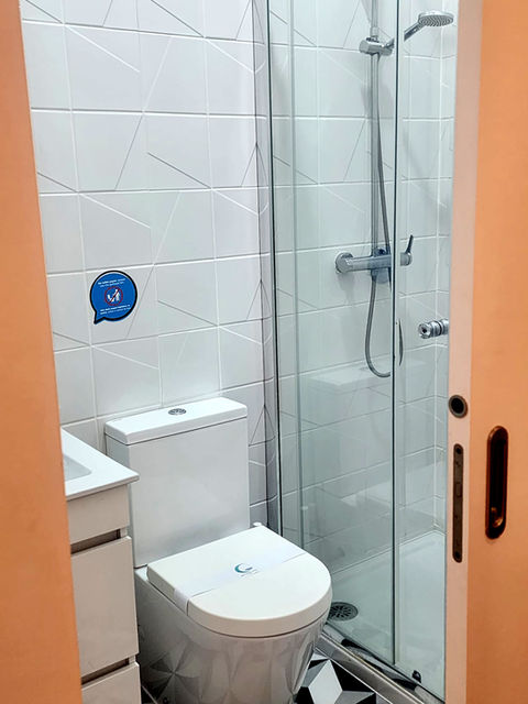 Modern bathroom with glass shower and toilet
