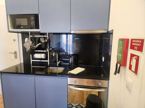 Modern apartment kitchen: sleek cabinets, granite counters