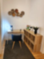 Modern home office with desk, chair, and shelving
