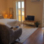 Comfortable studio apartment with double bed, TV, and balcony