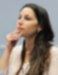 Woman listening intently, hand on chin