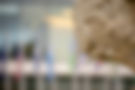 Ornate stone carving, blurred building background